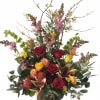 Blooming branches, sweet-smelling lilies, pincushion protea, and an assortment of roses make