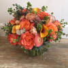 This is a mix of California sunset colors including roses, ranunculus, tulips
