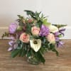 A lovely mix of seasonal flowers.  Colors as well as flowers