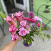 This perfect arrangement has lavender roses, pink lily&rsquo;s, pink gerbera, lavender carnations