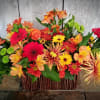 The mixture of autumn flowers welcomes your (or their) guests with vibrant