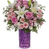 Bursting with perfect pink roses and snow white lilies, this sparkling cut