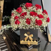 box of roses, babies breath and chocolates added 