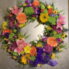 A vibrant and colorful tribute of seasonal blooms - wreath display- perfect