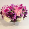 This beauty includes beautiful roses, orchids, hydrangea and more in elegant pedestal