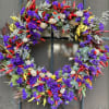 a mix of dry chili pepper, blue statice white mini cotton, and