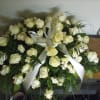 Elegant DIY casket spray with all white roses 