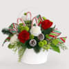 Jolly basket of red roses, white carnations and green button poms. 