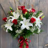 This arrangement is a little something more than just a dozen roses.