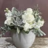 Succulents and floral blooms nestled together 