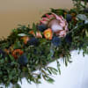 This garland is both striking and elegant. Using the boldness of protea