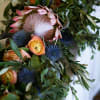 This garland is both striking and elegant. Using the boldness of protea