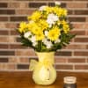 Vase of daisies and mini carnations