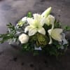white ceramic container, white lilies, roses, succulent, dusty miller