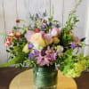 A colorful and bright bouquet with greens, perfect for any occasion!
