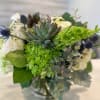 cyllinder vase filled with todays freshest flowers. 
hydrangea, roses, thistle,succulents,eucalyptus,bells of ireland