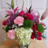 Beautiful arrangement in a galvanized vase with Roses , Lillies , Carnations