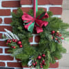 Deck the halls in classic Christmas style! Our traditional wreath is crafted