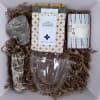 Blended tea packages, a double walled mug, sage bundle, mints, packaged in