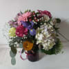 Artistic mix of varied flowers sprinkled with babith breath 