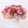 Arrangement includes the folly flowers; hydrangea, spray roses, and roses.