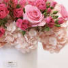 Arrangement includes the folly flowers; hydrangea, spray roses, and roses.