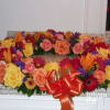 A mix of fall flowers create a stunning tribute for the season.