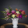 Lovely design including rose, snapdragon, sweet william, astroemeria and accents in a