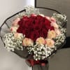 A beautiful red rose with colored white roses and a hint of