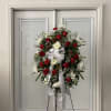 With red flowers that symbolize love and white flowers that symbolize reverence