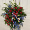 Standing tall proud and patriotic this dazzling free-standing spray is like a