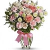 Pretty pink roses, spray roses and miniature carnations, white button spray chrysanthemums