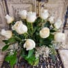 White roses of the highest quality with foliage and fillers.