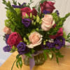 This arrangement includes Roses, Lisianthus, hydrangea
