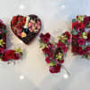 A special Valentine&rsquo;s Day arrangement filled with roses, spray roses, orchids, and