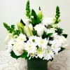 This beautiful  handcrafted bouquet of white roses with lilies and dainty