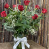 This beautiful arrangement of red roses is steeped in tradition, but if