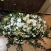 Whole casket spray of white roses, lilies, daisies, alstroemeria and carnations