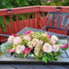 Antique Hydrangeas, Roses, Cala lilies, Wax flowers, Eucalyptus 
