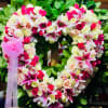 Pink &amp; White open heart on a wooden stand