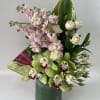 Awesome one side arrangement with a beautiful green cymbidium and pink stocks.