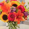 Sunflowers,orange liies, roses, purple stock or purple carnations orange alstroemeria with greens