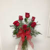 6 roses beautifuuly arranged with mixed foliage and accent flowers. The choice