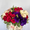 Red Roses, Blush Roses, Purple Lisianthus, Pink Coffee Bean, and added greenery