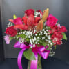 The violet and bright red flower bouquet delivery blossoms with gorgeous jewel