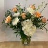 This fun bouquet contains white hydrangea, pink roses, larkspur and euchalyptus. Perfect