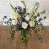 This beautiful bouquet contains white roses, delphinium, larkspur and euchalyptus. Perfect gift