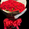 One-hundred red 60cm roses wrapped in a waterproof paper with a bow
Shown