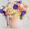 Nice blush pink box arranged with pink flowers and decorated with purple