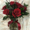 Deep red Premium Roses with large blooms, beautifully accented with upscale greenery
